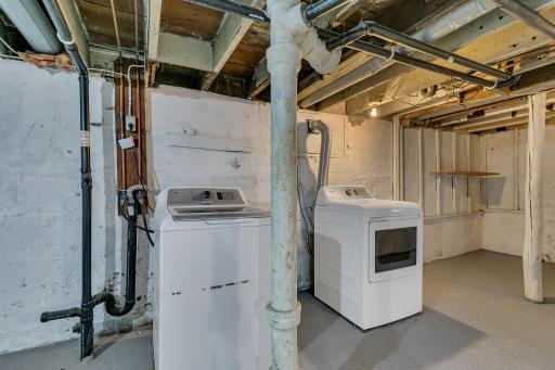 The lower level houses the laundry area. The washer and dryer can stay with the home.