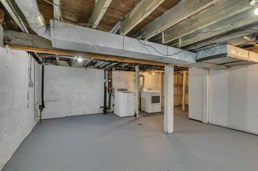 The lower level is wide-open and offers an impressive amount of storage and endless potential for hobbies, workspace, or future finishing possibilities.