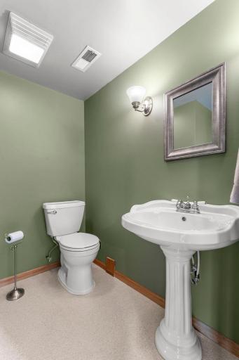 An existing, convenient Â½ bath adds functionality. The lower-level laundry area includes an Electrolux front-load washer and dryer along with a utility sink.