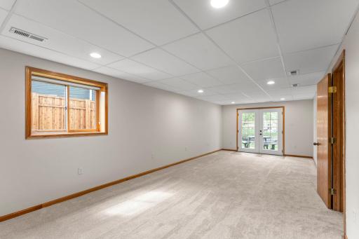 The lower level provides exceptional additional living space with a large, light-filled family room perfect for relaxing or entertaining. French doors lead directly to the backyard patio.