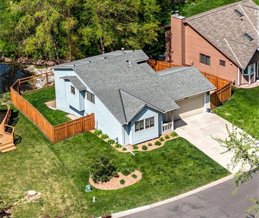 The attached 2-car garage offers year-round vehicle protection, additional storage, and functional workspace with built-in cabinets and a workbench area.