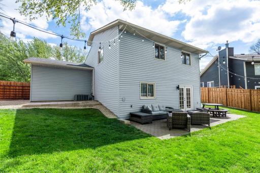 Behind the garage, a dedicated shed pad provides space for a future storage shed if desired.