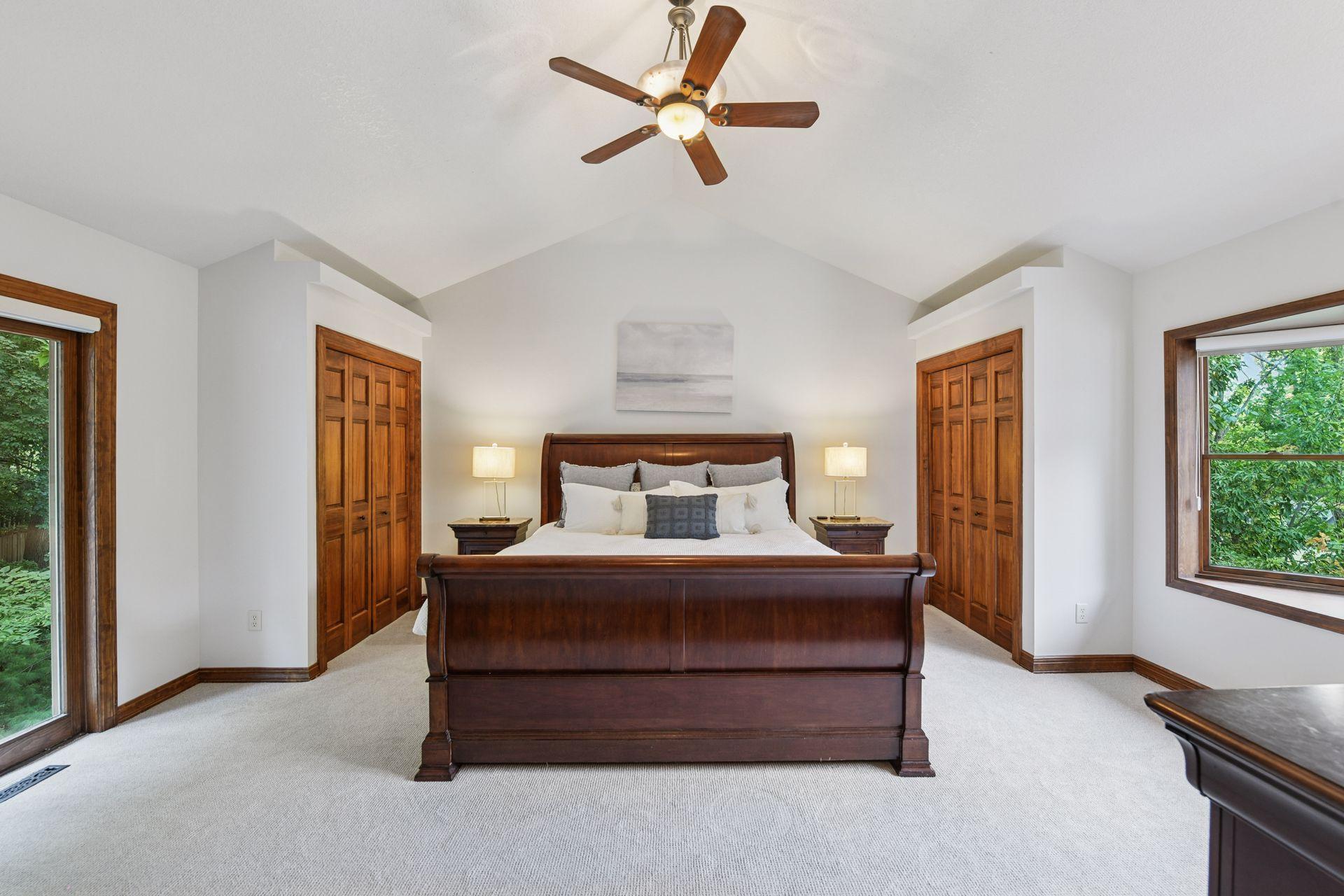 The upper level showcases the vaulted primary bedroom suite with three-quarter bathroom, two additional bedrooms, additional full bathroom, and a loft.
