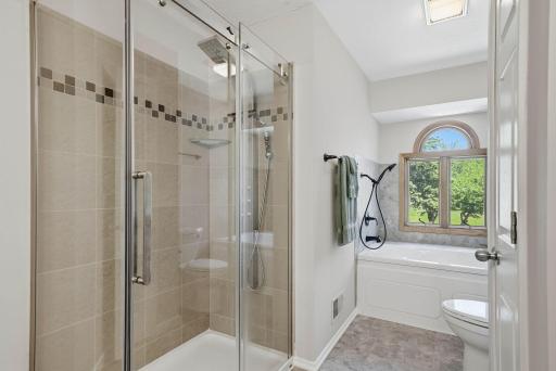 Bathroom features step-in shower w/ glass wall surround.