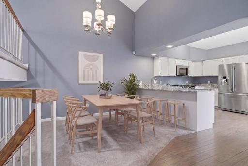 Main level flows nicely from kitchen to dining area. (virtually staged)