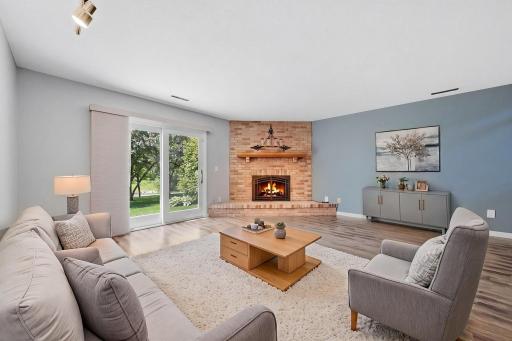 Lower level family is perfect space to rest after a long day. (virtually staged)