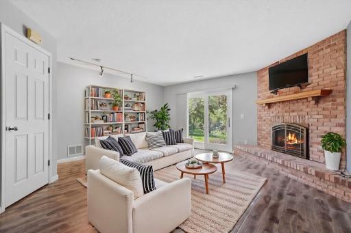Family room features walkout to patio & outdoor space. (virtually staged)