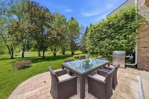 Paver patio is perfect place to unwind & have a cold beverage this time of year. (virtually staged)