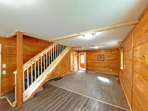 The open layout offers plenty of room for gathering, relaxing, and entertaining, while large windows bring in natural light.