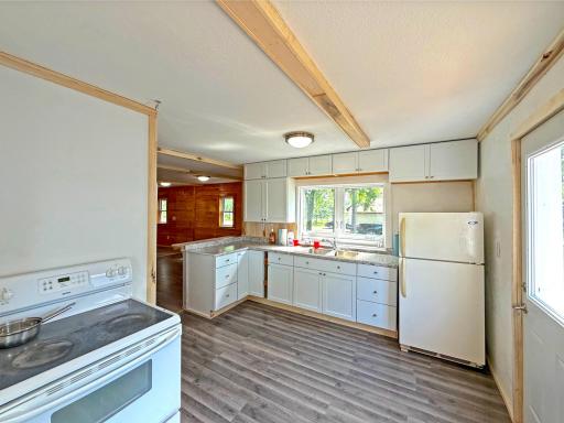 This inviting country kitchen blends recent updates with rustic charm offering plenty of room for gathering with friends.