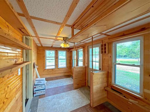 Wrapped in warm knotty pine and lined with windows on nearly every side, the space is filled with natural light and peaceful views.