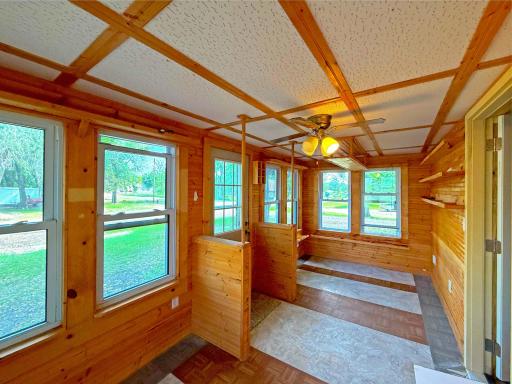 This charming 3-season porch is the perfect place to relax and take in the beauty of the surrounding countryside.