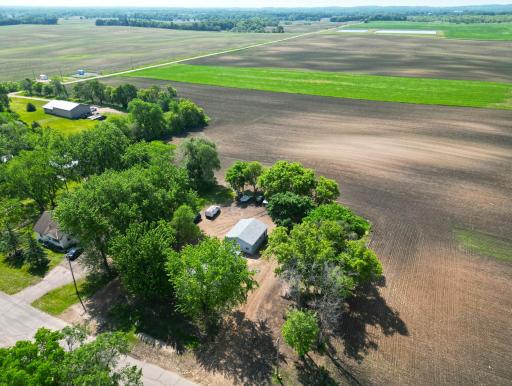 Nestled among a picturesque grove of trees, this charming property offers the perfect blend of privacy yet close to town.
