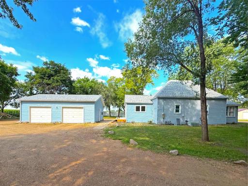 Step outside to a recently added paver stepping stones that connects the home to the brand-new double detached garage.
