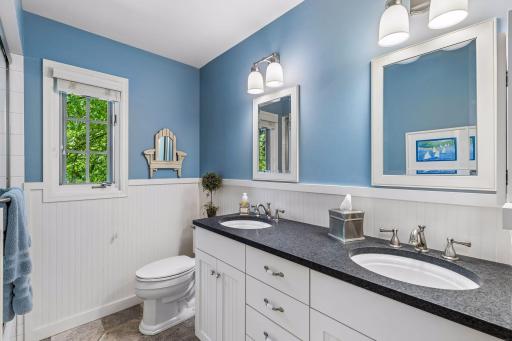 Full bathroom in the hallway of the upper level