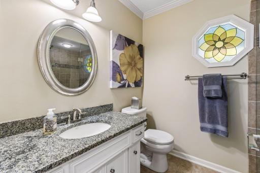 Main floor 3/4 bathroom with tiled walk-in shower