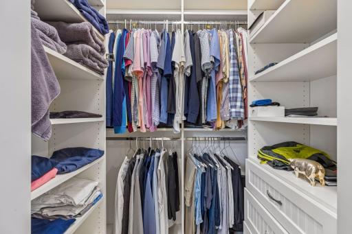 His closet with organizational components