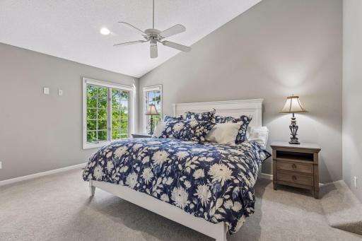 Head to the upper level to discover the luxurious primary bedroom