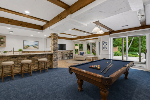 Virtually staged to show how there could be a pool table and hang out area