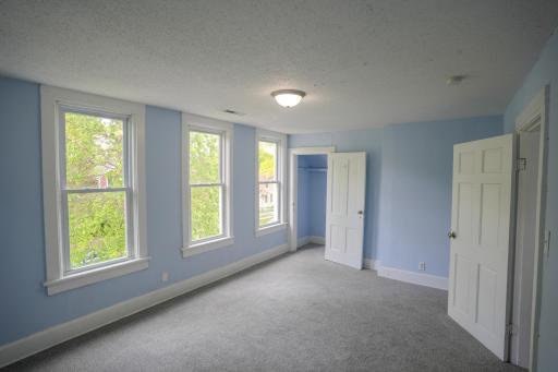 The main bedroom is full of natural light