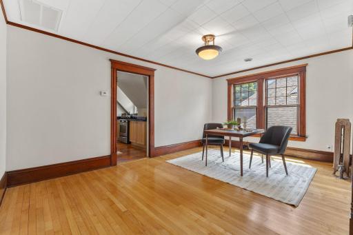 Walk into to this large open dining area with hard wood floors and Souther exposure.