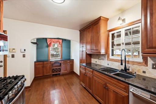 The kitchen has a large prep area which could also be a great coffee bar. A perfect blend of old and new. Note the arch showcasing the coffee bar is the same design as the arch in the dining room.