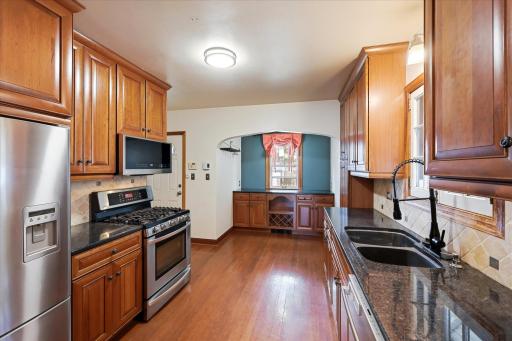 Updated kitchen has plenty of space and stainless appliances including a gas stove. The sink, dishwasher and microwave have recently been replaced.