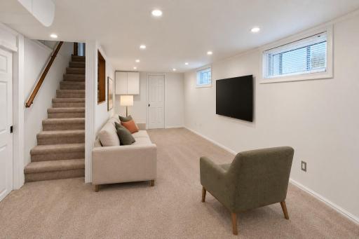 Lower level family room could also serve as a great office. This room is virtually staged. Can lighting and neutral carpeting throughout.