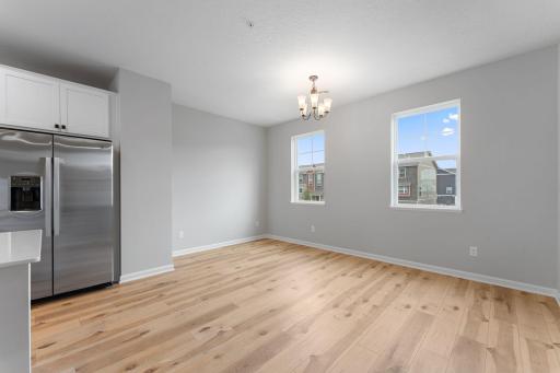 Imagine hosting family celebrations in this beautiful dining room! The expansive windows and 9'ceilings create the wow factor your looking for in a new home. Similar home shown, Color and options can vary.