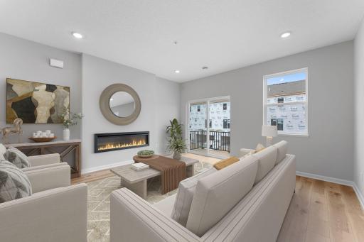 The spacious family room can accommodate many furniture arrangements and easily entertain larger gatherings. Similar home shown, Color and options can vary.
