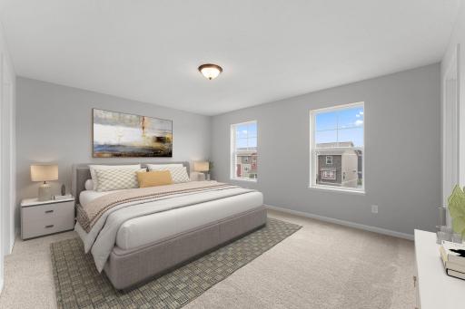 Owner's bedroom suite with generous use of windows. Similar home shown, Color and options can vary.