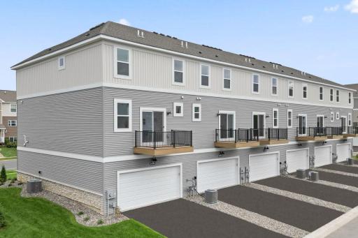 Two stall rear entry garage with maintenance free deck. Similar home shown, Color can vary.