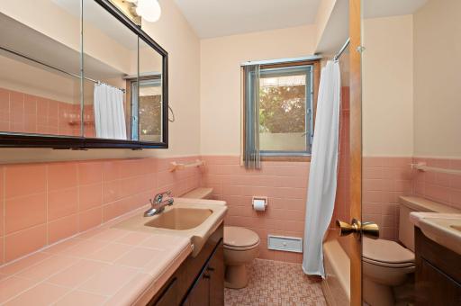 Vintage and spotless upper level full bath.