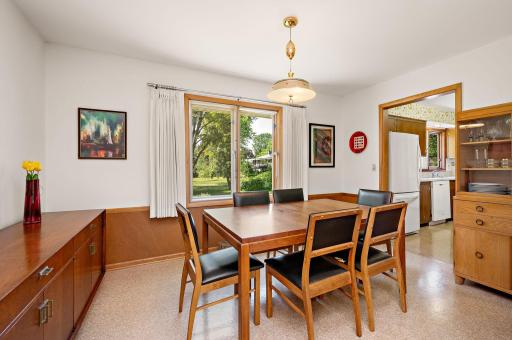 Formal dining - easily fits table and chairs for 6 + hutch. Looks out to backyard.