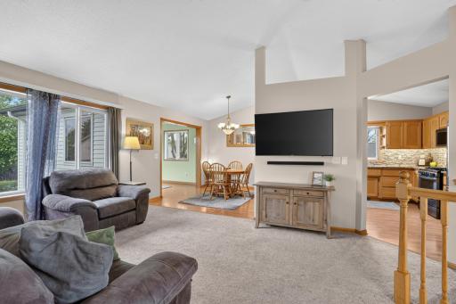 Vaulted ceilings and abundant natural light create an open, airy atmosphere.