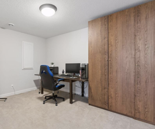 Downstairs bonus room is perfect for another office or a fitness room