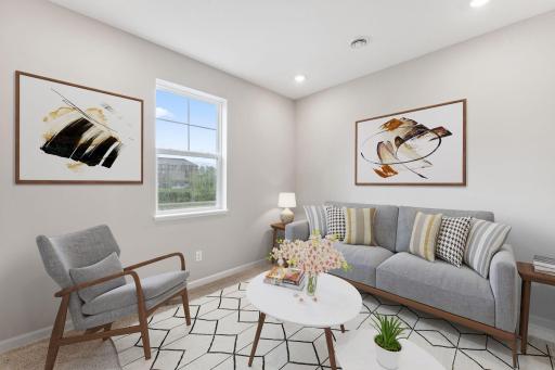 Rec room staged. Similar home shown, color and options can vary.