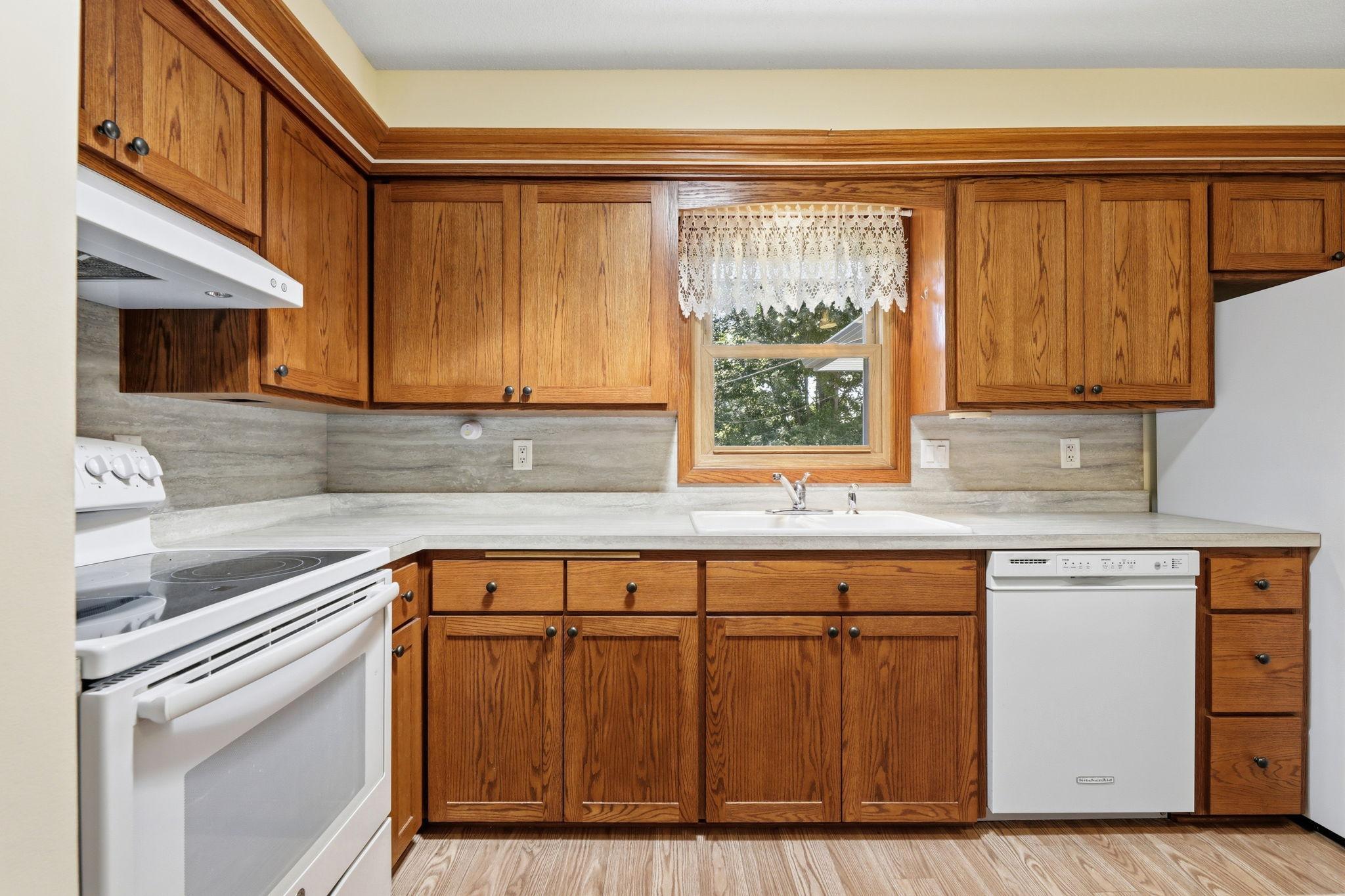 Spotless kitchen with tons of counter space, updated cabinets, matching appliance package and drawers that can handle 100 pounds of weight.