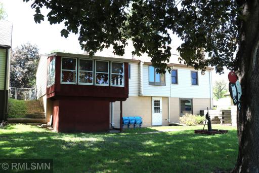 Back of home, walkout basement, screen porch and shop area.