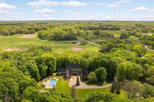 Enjoy the pool, the sport court or hot tub! Property is adjacent to acres of wetland ensuring privacy.