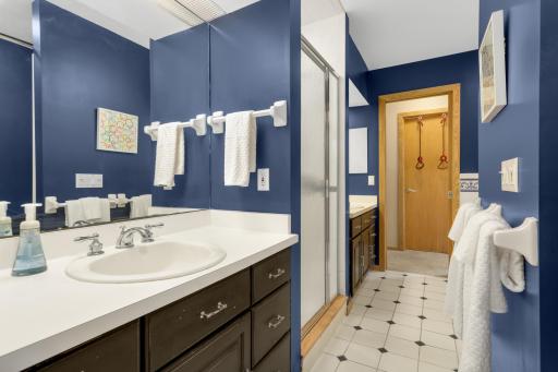 Jack & Jill bath with separate vanities, walk-in shower and tub.