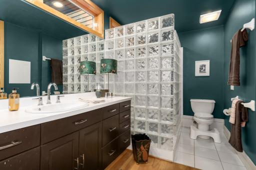 Large primary bath with walk-in shower and large soaking tub.