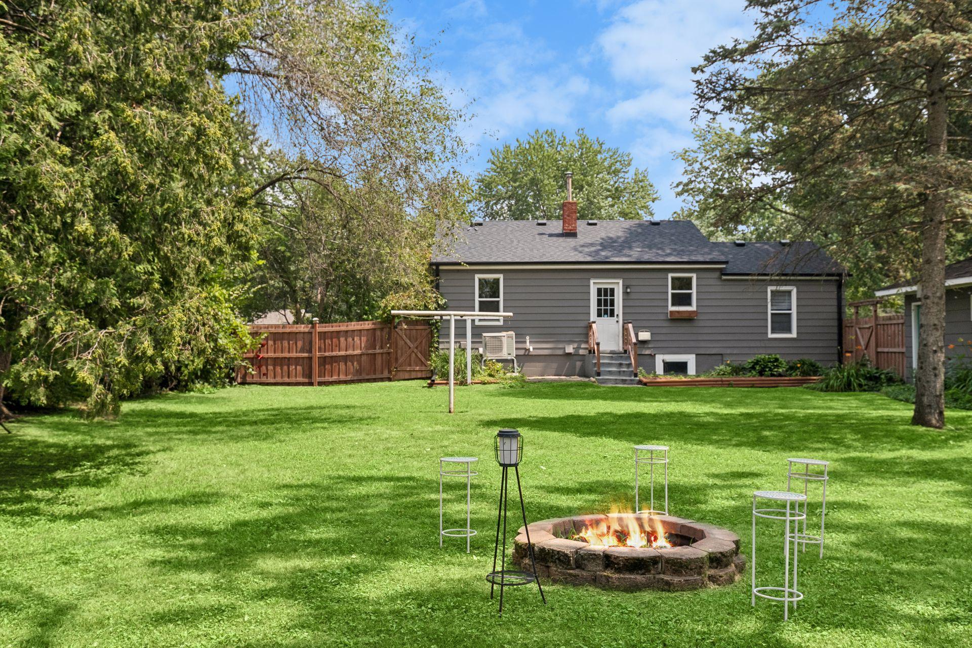 The back of the home overlooks a fenced yard built for play, gatherings, and everything in between.