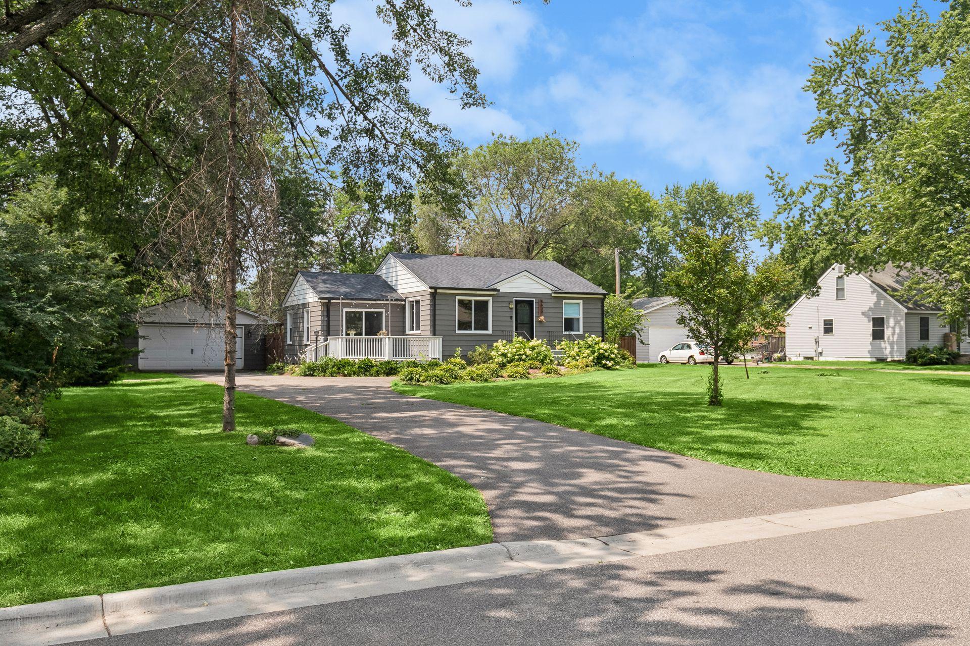 Tucked back from the street with a long driveway and wide open front yard — first impressions done right.