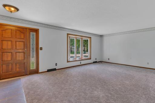 This south facing living room with a big bow window lets in all that natural light.