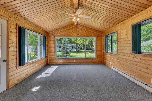 This 4 season sunroom just speaks peaceful. It overlooks the backyard and offers a nice retreat area to enjoy year around.
