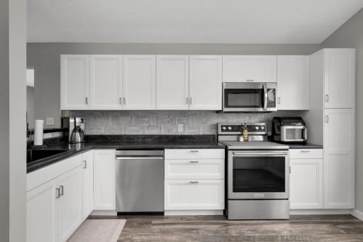 Fully updated kitchen with new stainless steel appliances, new flooring and so much storage!