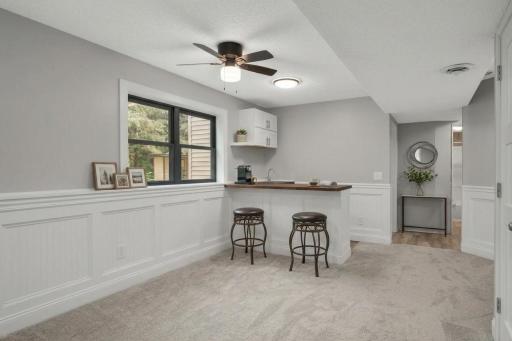 Make this basement bar your own with white trim and upgrading the counter top to a wood finish. Your options are truly endless (AI generated photo)