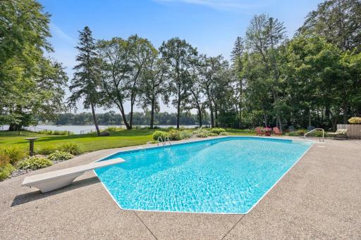 40 ft inground heated pool with diving board and large patio