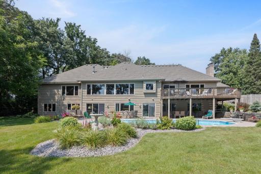 Walkout rambler with brick & cedar siding and extensive landscaping throughout.